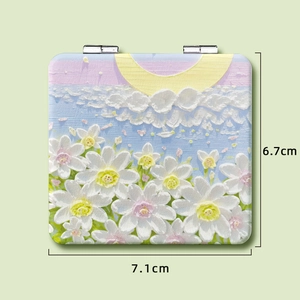Detailed view of square makeup mirror with floral relief patterns and size dimensions