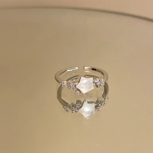 Elegant adjustable star ring with white gemstone and sparkling cubic zirconia accents