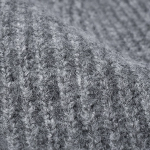 Close-up of grey ribbed knit beanie showing soft fuzzy texture and high-quality wool fibers