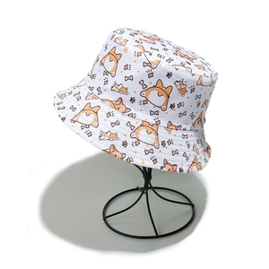 Detailed view of white cotton bucket hat with cute corgi prints on a metal stand