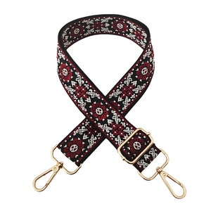 Detail of 3.8cm wide jacquard strap with ethnic floral embroidery and gold metal hardware