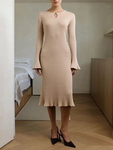 Elegant beige ribbed knit midi dress featuring flared sleeves and subtle hollow-out neckline