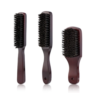 Three professional wood beard brushes with black bristles on a reflective white background