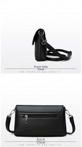 Detail view of black lychee grain leather crossbody bag showing back zipper and side profile