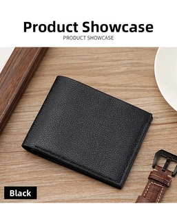 Detailed view of a black bifold wallet with lychee grain texture on a wooden surface