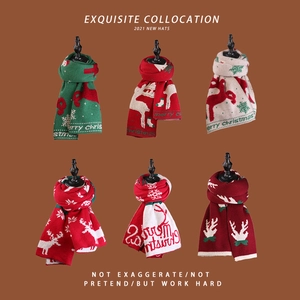 Close-up of knit Christmas scarves with reindeer and snowflake patterns in various colors