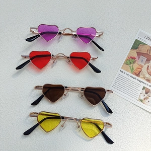 Stylish heart shaped sunglasses for children featuring colorful lenses and slim metal frames