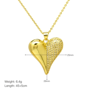 Detail view of heart pendant with polished gold finish and zircon pavé showing dimensions