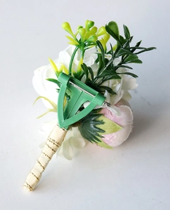Detailed back view of wedding corsage featuring T-pin fastener and satin gold thread wrap
