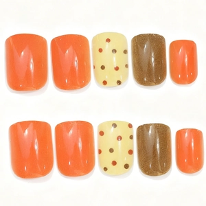 Fall maple leaf and polka dot square press-on nails in orange and matte brown tones