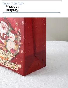 Detail of Christmas non-woven gift bag with Santa Claus print and sturdy bottom gusset