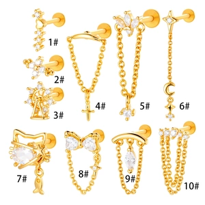 Set of 10 gold titanium labret studs with zircon crystals in star, moon, and bow designs