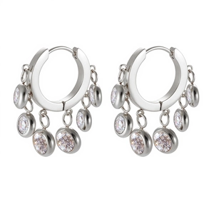 Detailed view of silver hoop earrings featuring sparkling round cubic zirconia stones