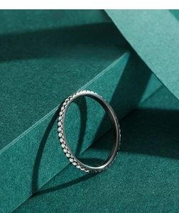 Detail of s925 silver ring featuring micro-paved brilliant cut cubic zirconia stones