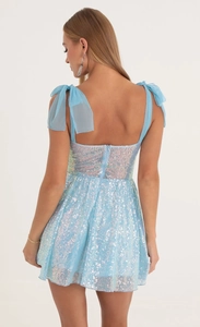 Light blue sequined mini dress with open back and tulle bow shoulder straps detail