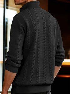 Side view of men's black cable knit sweater featuring a high neck zipper and ribbed cuffs