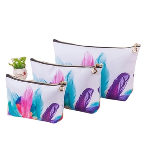Three sizes of waterproof PU makeup bags with colorful feather prints and gold zippers