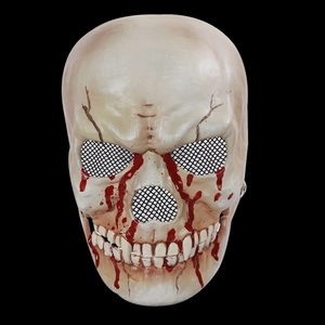 Macro detail of scary skull mask with realistic blood splatter and metal mesh eyes