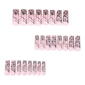 French leopard print press-on nails with pink base, rhinestones and silver 3D stars
