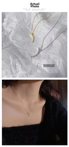 Detail of moon pendant necklaces in gold and silver showing intricate micro-inlaid zircon