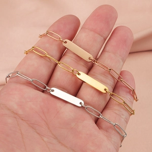 Polished stainless steel paperclip bracelets in gold, rose gold, and silver finishes