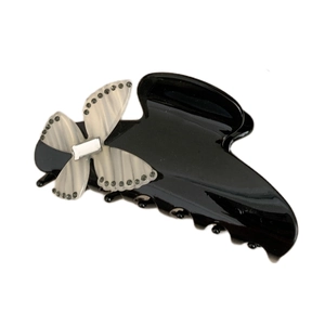 Elegant black acetate hair claw clip with a sparkling rhinestone butterfly decoration