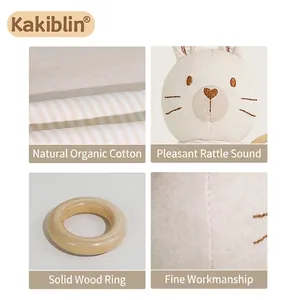 Organic cotton baby rattle with wooden ring and cute rabbit embroidery details