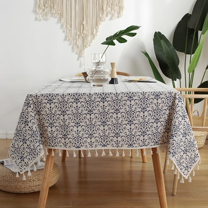 Rectangle beige cotton linen tablecloth with blue vintage floral pattern and tassels
