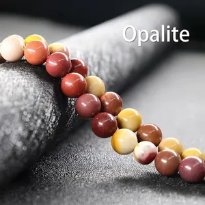 Macro detail of natural Mookaite Jasper round beads showing unique stone texture