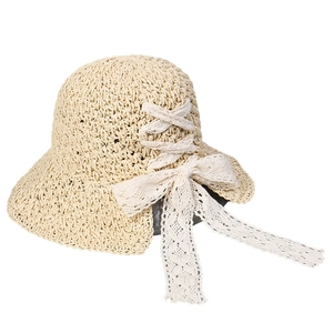 Pastoral straw hat with wide brim and white lace bow decoration for summer beach travel
