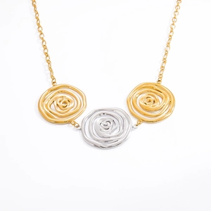 Two-tone stainless steel necklace with three spiral disc pendants on golden chain