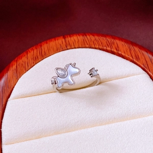 Detail of silver unicorn ring with shimmering white shell inlay and zircon accents