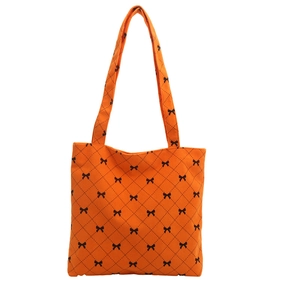 Sac fourre-tout en velours côtelé orange avec motifs nœuds noirs et grandes anses