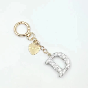 Golden keychain with sparkling crystal letter D and engraved I LOVE YOU heart pendant