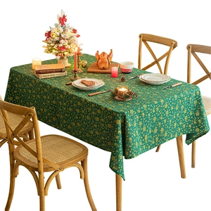 Green Christmas tablecloth with gold snowflake and tree prints for festive table decor