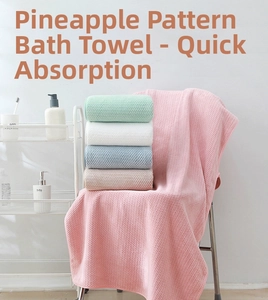 Detail of coral fleece waffle weave towels showing soft absorbent honeycomb texture