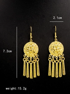 Detailed view of bohemian peacock earrings with gold tassels showing size and weight specs