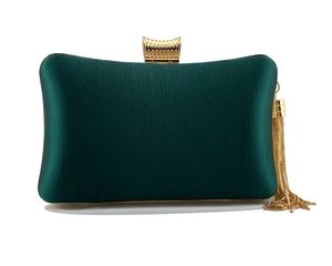 Detail of dark green satin clutch with gold metal buckle and long tassel fringe