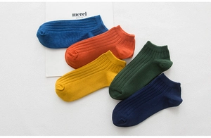 Detailed view of colorful ribbed cotton socks showing texture and vibrant seasonal colors