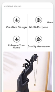 Macro detail of black matte resin hand display holder for rings and jewelry storage