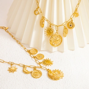 Gold stainless steel celestial necklace featuring sun, moon, and star charms on link chain