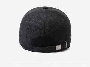 Close-up of the adjustable metal buckle and textured wool fabric on the back of the baseball cap
