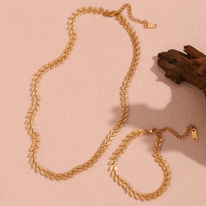 Detail of 18K gold-plated stainless steel leaf chain necklace and bracelet set