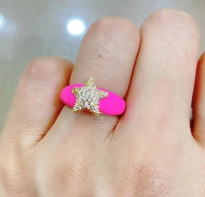 Adjustable gold star ring with sparkling crystals and vibrant neon pink enamel finish