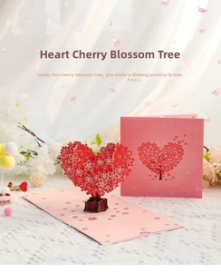 3D pop-up greeting card featuring a heart-shaped cherry blossom tree with a pink envelope