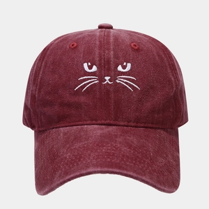 Detail of cute cat embroidery on vintage dark red washed cotton baseball cap
