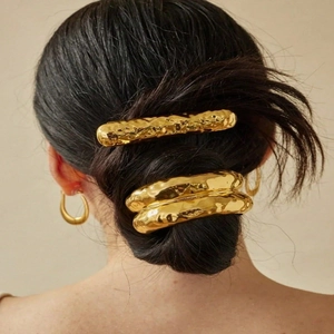 Lava texture gold hair clips on hair with irregular hammered metal finish detail