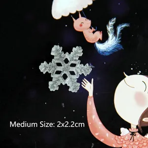 Detailed macro view of medium translucent snowflake resin charm with glitter, 2x2.2cm size