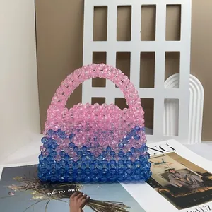 Detail of pink and blue handcrafted beaded handbag with crystal acrylic texture