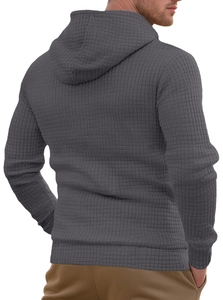 Macro detail of men's dark grey hoodie featuring premium waffle texture fabric from behind